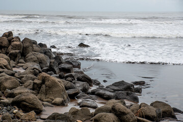 Wild rocky beach or Seascape with powerful waves, Maharashtra, India, Asia.