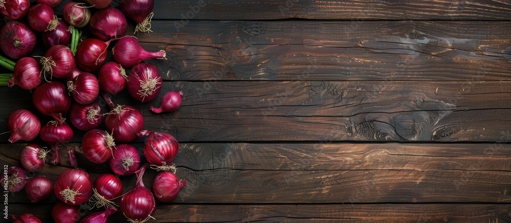 Poster Rustic wood background with red onions creating a captivating composition for copy space image.