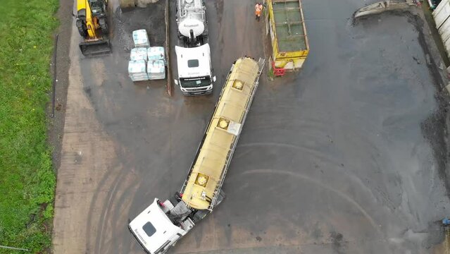 Aerial drone footage of the a Waste Transfer Station Liquid Treatment Plant located in the city of York North Yorkshire in the UK showing a large tanker reversing into a space to unload the tanker