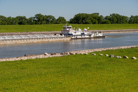 View of mississippi river with barge transport and greenery, st louis, missouri, united states.