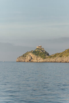 View of tranquil Amalfi Coast with Torre del Capo di Conca, Campania, Italy.