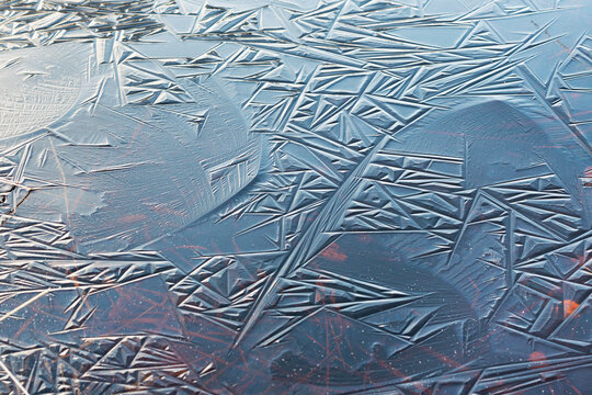 View of abstract lines in frozen ice, winter, Hautes Fagnes, Belgium.