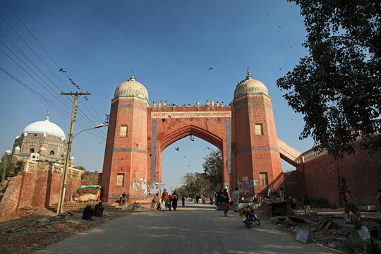 View of Multan Fort with archway, dome, and people, Multan, Pakistan.