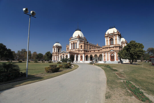 View of Sadiq Ghar Palace with Colonial Architecture and Scenic Garden, Dera Nawab Sahib, Punjab, Pakistan.
