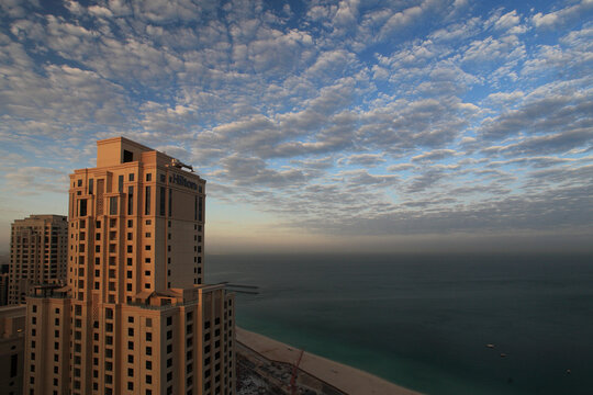 View of modern urban skyline with skyscrapers and sea, dubai, united arab emirates.