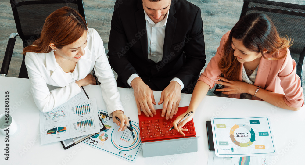 Wall mural Businessman is in meeting discussion with colleague businesswomen in modern workplace office. People corporate business team concept. uds