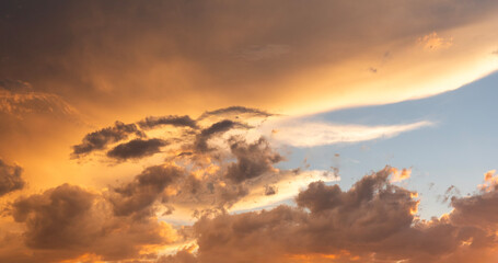 Bright orange sunset sky with clouds. Evening sky background . 