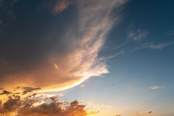 Bright orange sunset sky with clouds. Evening sky background . 