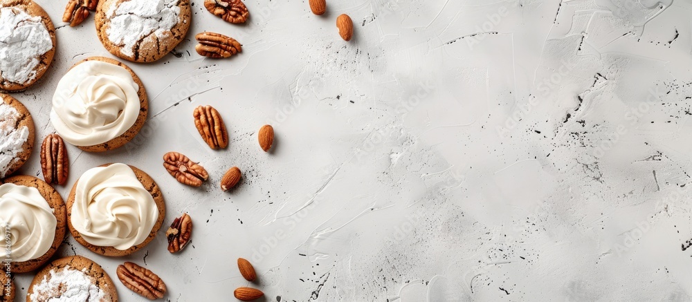 Aufkleber Cookies with nuts and white icing on a concrete background, with space for text or graphics. Copy space image. Place for adding text and design