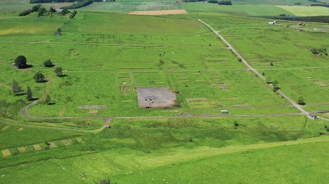Aerial view of abandoned ruins and scenic countryside at Stobs Camp, Hawick, Scotland, United Kingdom.