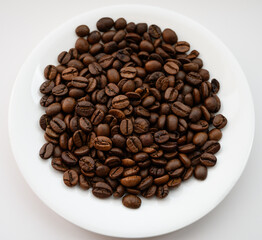 Roasted coffee beans on dark background. Selective focus.