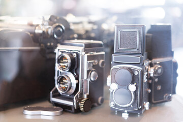 vintage twin lens camera ,retro medium format camera On the background bokeh light