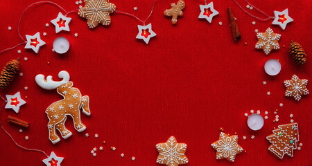 Holiday Cheer with Festive Gingerbread Decorations. A Vibrant Red Background Adorned with Traditional Christmas Cookies and lights