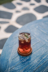 Fresh drink of iced tea mixed with mango.