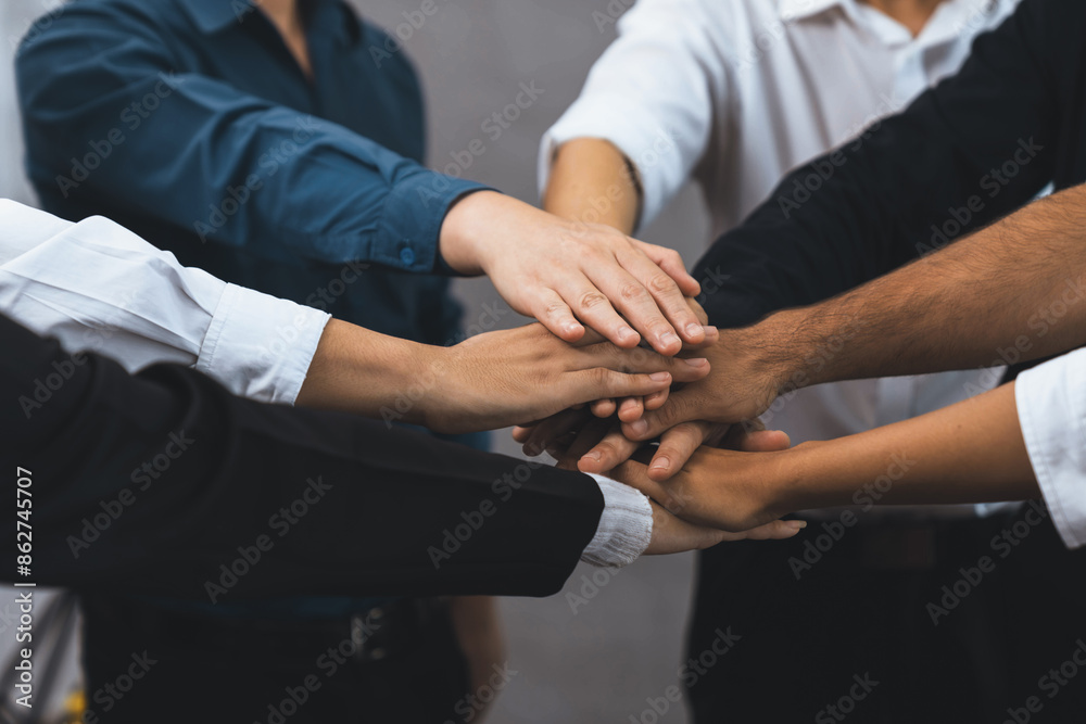 Poster group of diverse office worker join hand together in office room symbolize business synergy and stro