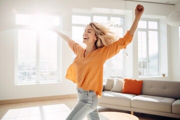 Joyful woman dancing in a sunlit living room