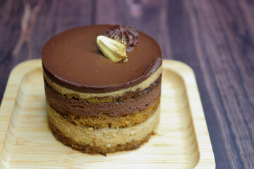 The classic French Opera Cake is made with layers of almond sponge,  coffee syrup, French buttercream, and chocolate ganache. This healthy mini cake is vegan, gluten free, and refined sugar free.
