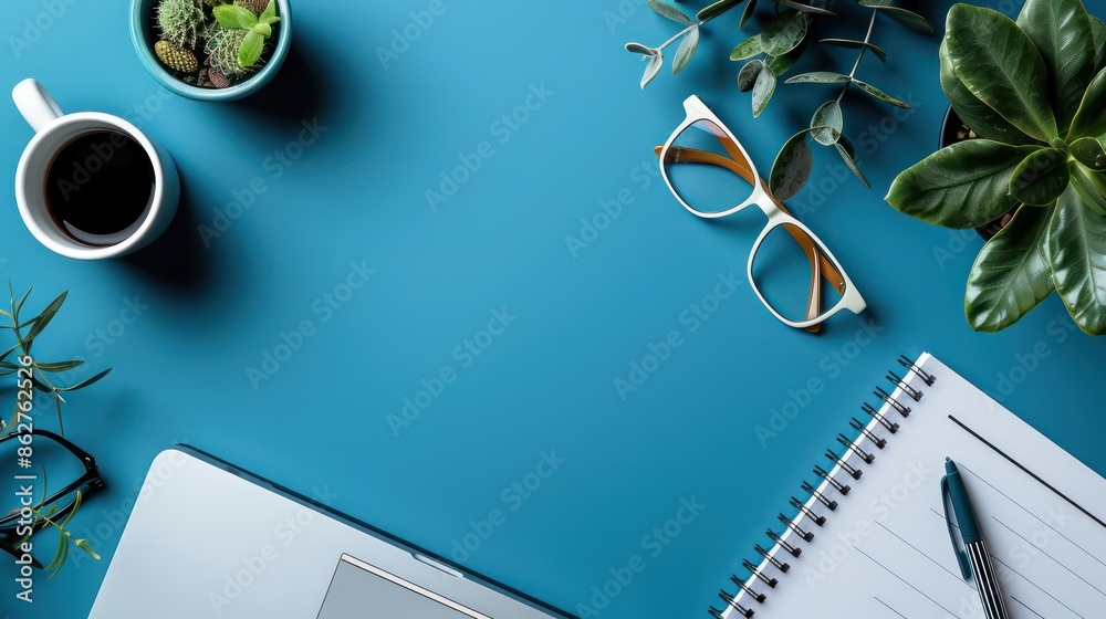 Poster A blue background with a notebook and a pen on it. A cup of coffee is on the left side of the notebook