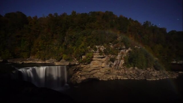 Waterfall Moonbow Rainbow Full Moon Cumberland Falls State Park Timelapse. Nighttime starry sky Tourist Destination Natural Phenomenon