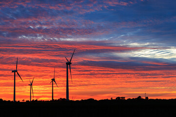 Wind turbines at sunset