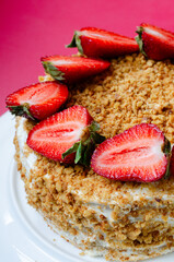 Crepe cake Medovik with sour cream vanilla cream and strawberries. Pancake cake Medovik decorated with strawberries.