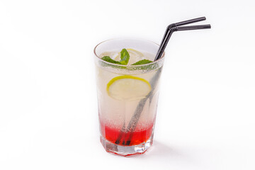 fresh lemonade in a glass on a white background
