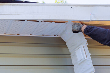 During remodeling house master makes repairs to fascia trim that was damaged