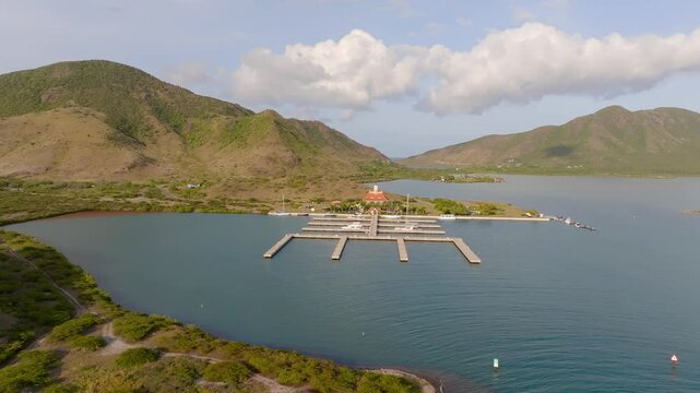Aerial view of Christophe Harbour Marina and Ballast Bay with hills and mountains, Frigate Bay, St Kitts and Nevis.