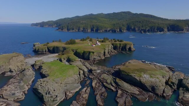 Aerial view of rugged coastline with Cape Flattery Lighthouse and rocky cliffs, Pacific Ocean, Cape Flattery, Washington, United States.