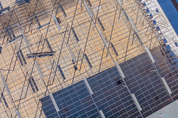 Building steel structures was completed during construction warehouse with installation of roof trusses