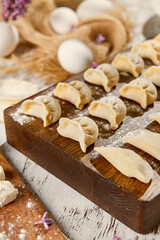 Rustic Dumpling Preparation Dough and Flour on Wooden Board in Sunlit Kitchen
