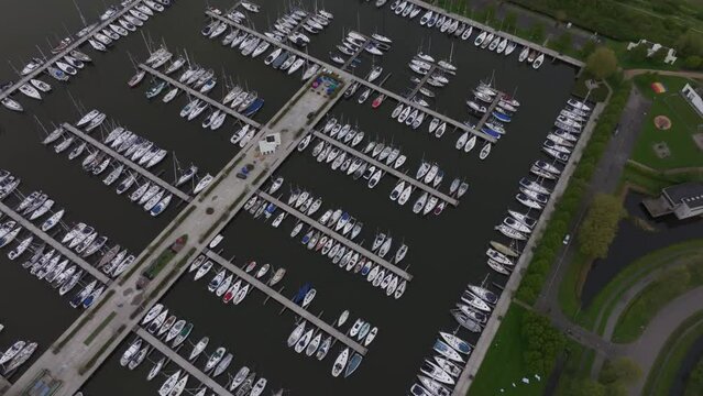 Aerial view of boats in harbour with marina and pier, Makkum, Friesland, Netherlands.