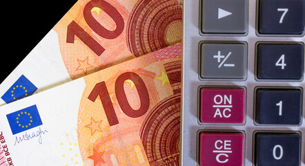 A fragment of a ten euro banknote with red and yellow parts