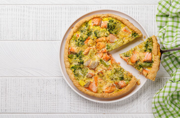 Homemade pie with salmon and broccoli