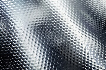 Glossy titanium surface with simple pattern for smartphone background. 