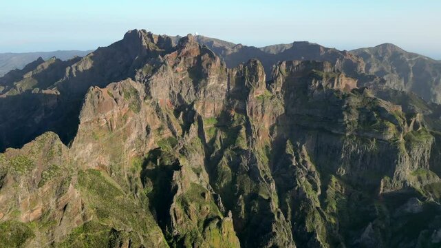Aerial view of rugged peak with cliffs and rock formations, Vereda do Pico Ruivo, Madeira, Portugal.