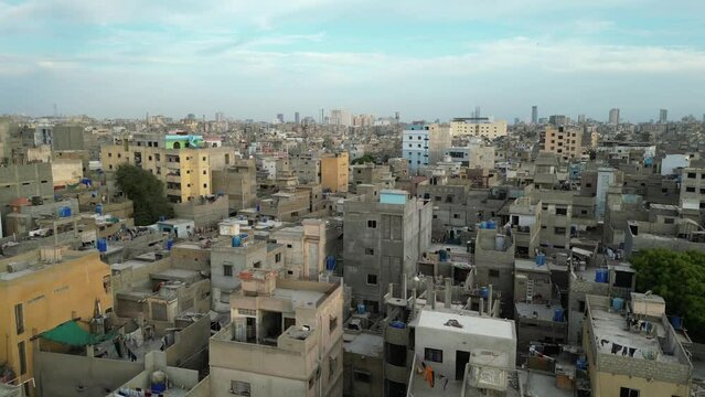 Aerial view of densely populated Lyari with residential rooftops and urban skyline, Karachi, Pakistan.