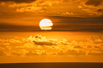 Beautiful golden sunset at the beau vallon beach, red sky, Mahe Seychelles