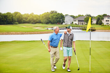 Obraz premium Men, golf course and team on green for tee off in field as members in club for health, wellness or business. Male people, putter and hole for sports, exercise or meeting as partner in company for fun