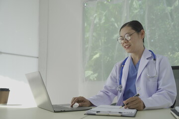 Fototapeta premium Pharmacist holds a prescription and tries to explain how to use the medicine to a patient. Pharmacy. Asian female health worker is explaining a prescription to a patient. Medicine Pharmacist.