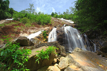 Naklejka premium Scenic of namtok ton nga chang waterfall or The Elephant Tusks Waterfall at Tone Nga Chang wildlife sanctuary in Songkhla Province, Thailand 