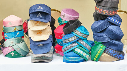 Women's and men's headdresses with Kazakh patterns