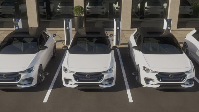 A row of generic autonomous electric cars charging in front of an office building. EV charging station. Decarbonisation and zero emission concept. 3d animation rendering.