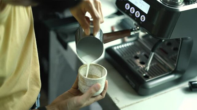 Beginner barista learns to create latte art, experience working HD video
