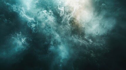 Fototapeta premium Dreamy abstract image of ethereal smoke swirling in shades of teal and white, creating a mystical and calming effect.
