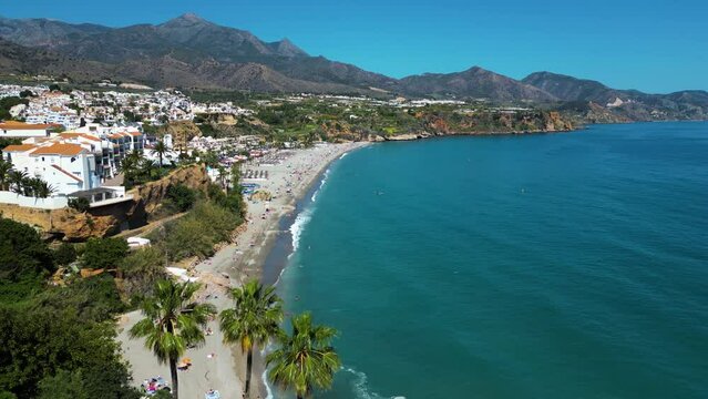 Aerial view of beautiful beach and ocean with mountains in Nerja, Andalusia, Spain.