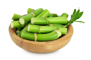 Green bamboo with leaves in wooden bowl isolated on white background with full depth of field