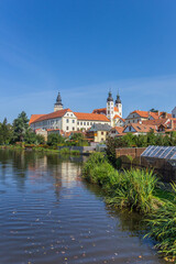 Fototapeta premium Historic castle at the lake in Telc, Czechia
