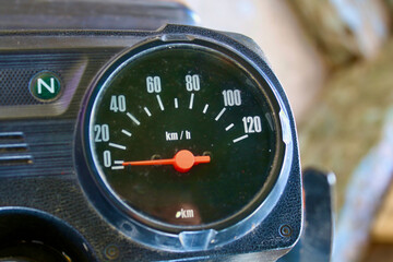 Speedometer on a motorcycle. The speedometer needle shows 0 km/h on the motorcycle dashboard.