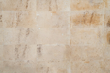 Vintage brown granite building tile wall texture and background seamless